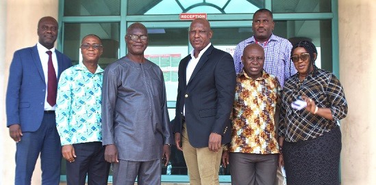 Ato Afful (3rd from right), MD, GCGL, with Dickens Thunde (3rd from left), Director, World Vision Ghana; Franklin Sowa (behind), Director, Sales and Marketing, GCGL, and Washington Mawuli Nuworkpor (2nd from left), Communications and Marketing Manager, World Vision Ghana. The rest include Samuel Essel (left),  Director, Finance and Administration, GCGL, and other officials of the World Vision after the meeting. Picture: ESTHER ADJORKOR ADJEI